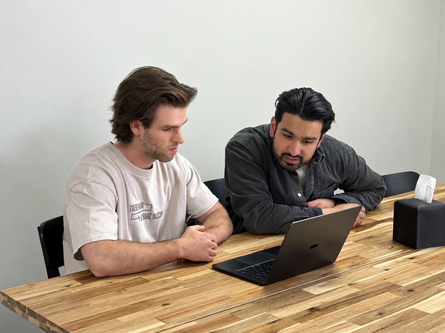 Jason and Arjun looking at a church website together